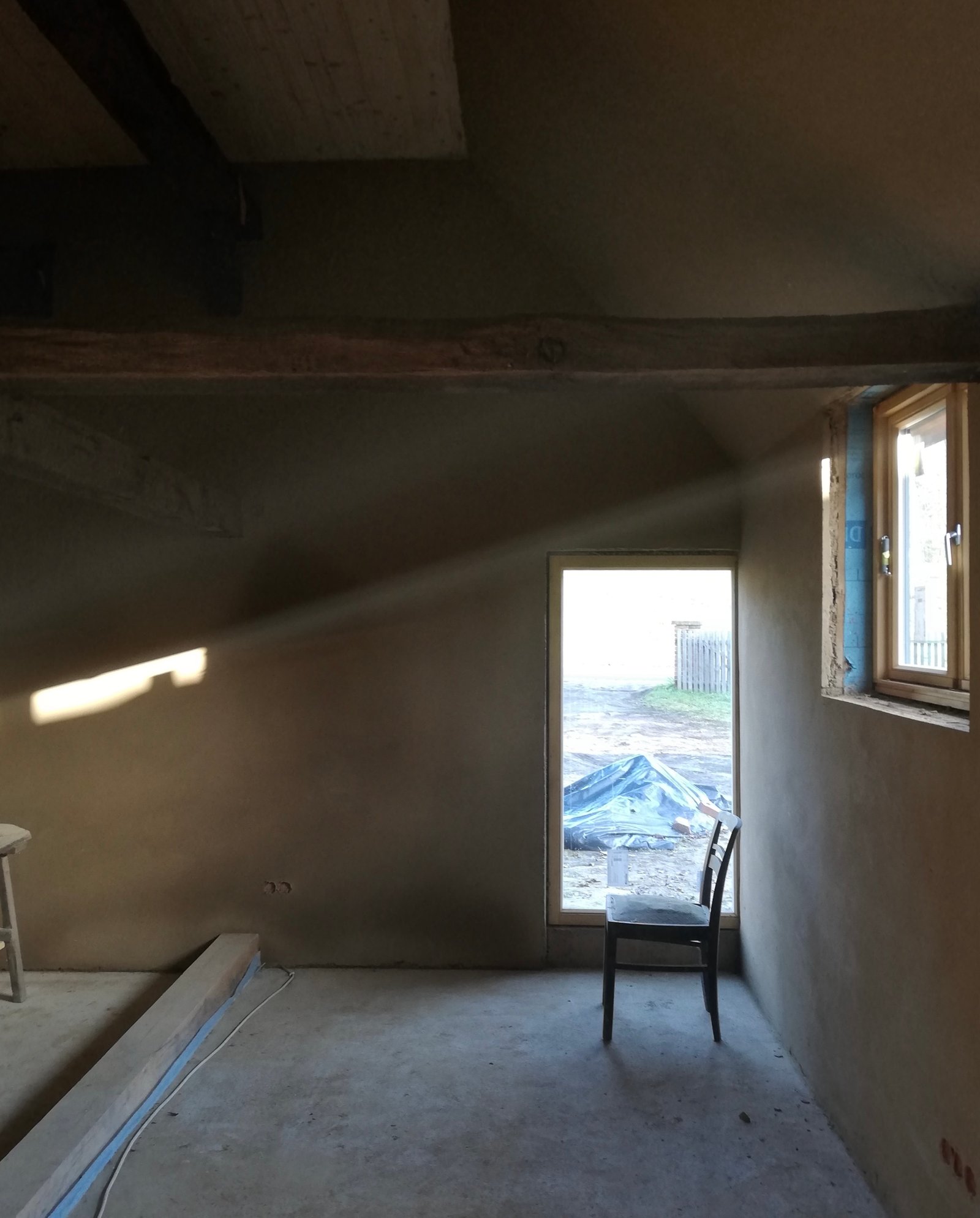 Fachwerkhaus Niedersachsen: Lehmunterputz auf Wand, freiliegende Holzbalken und Ziegel